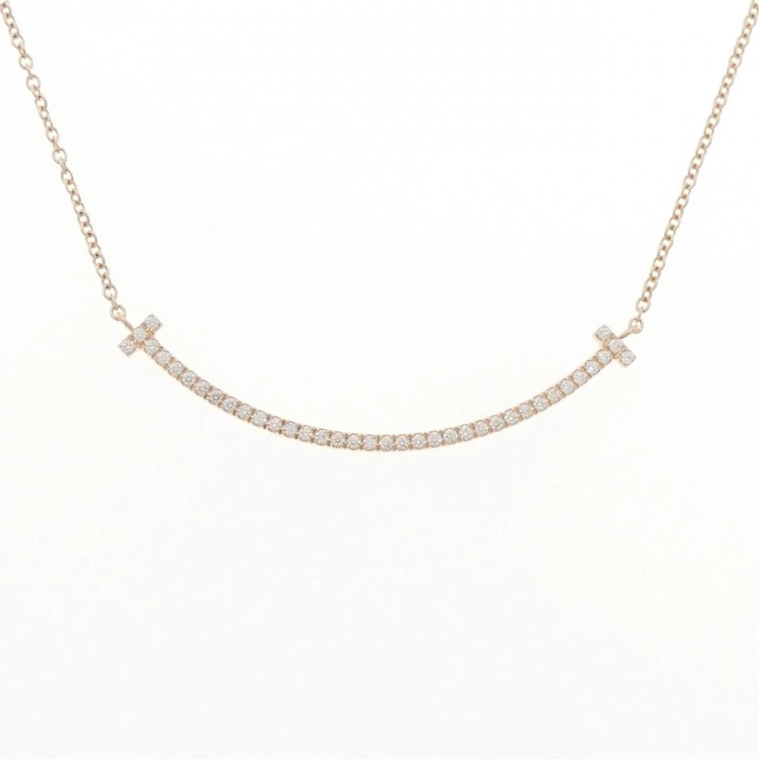 TIFFANY T SMILE SMALL NECKLACE: Tiffany T Smile Small Necklace Brand: Tiffany Type: Necklace Material: 750 Pink Gold, Main Stone/Creation Natural Color: Pink Gold Size: ActualSize Pendant top H x W: 3.5mmx37.1mm Chain Max.