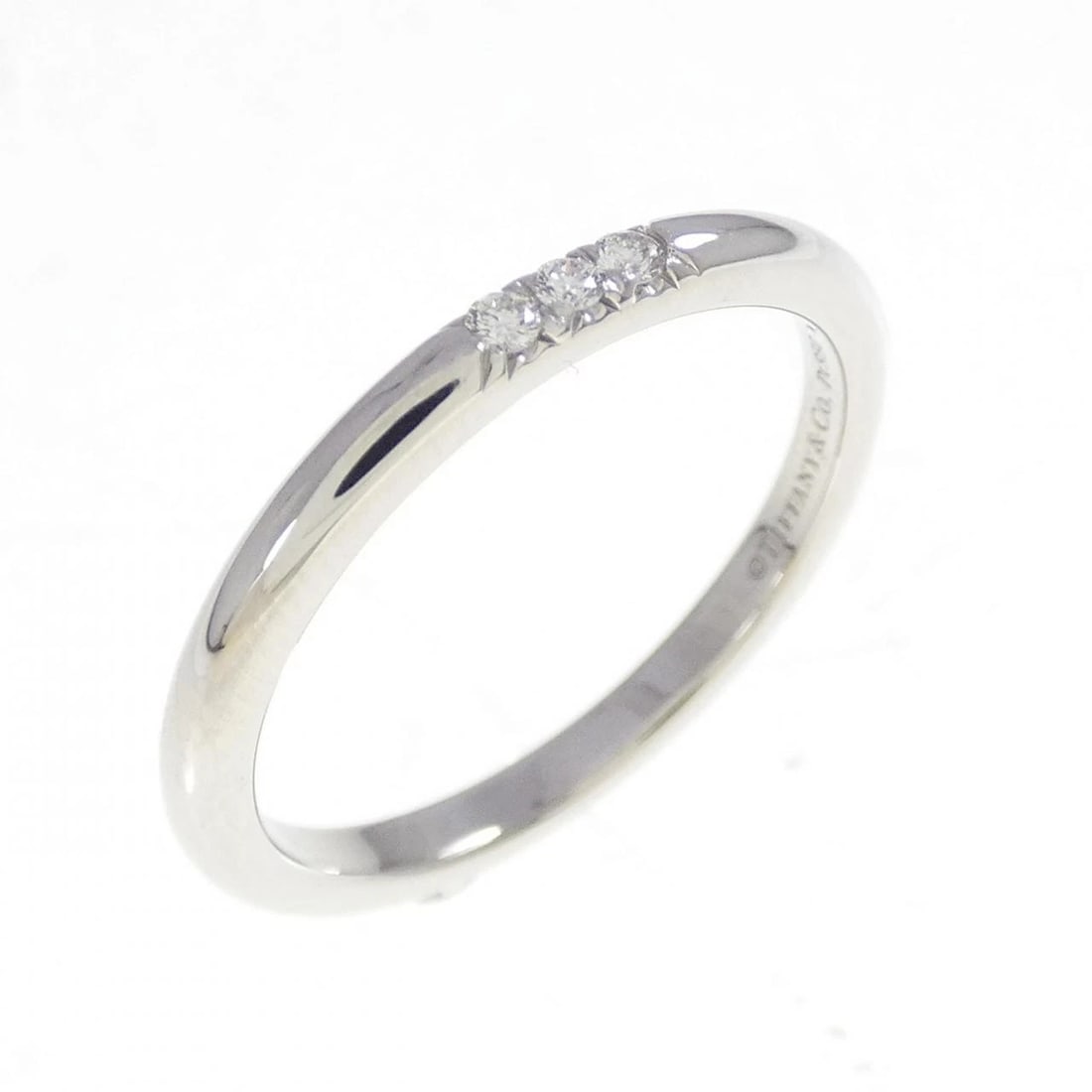 TIFFANY & CO. BAND RING: Tiffany & Co. band Ring Brand: Tiffany Type: Ring Material: Platinum 950, Main Stone/Creation Natural Color: White Size: 6 (US size) Accessories: None Accessories Notice: When purchasing