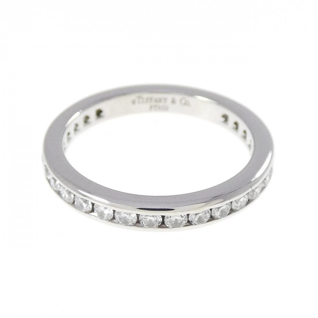 TIFFANY & CO. FULL CIRCLE CHANNEL SETTING RING: Tiffany & Co. Full Circle channel setting Ring Brand: Tiffany Type: Ring Material: Platinum 950, Main Stone/Creation Natural Color: White Size: 4.5-5 (US size) Accessories: None Accessories