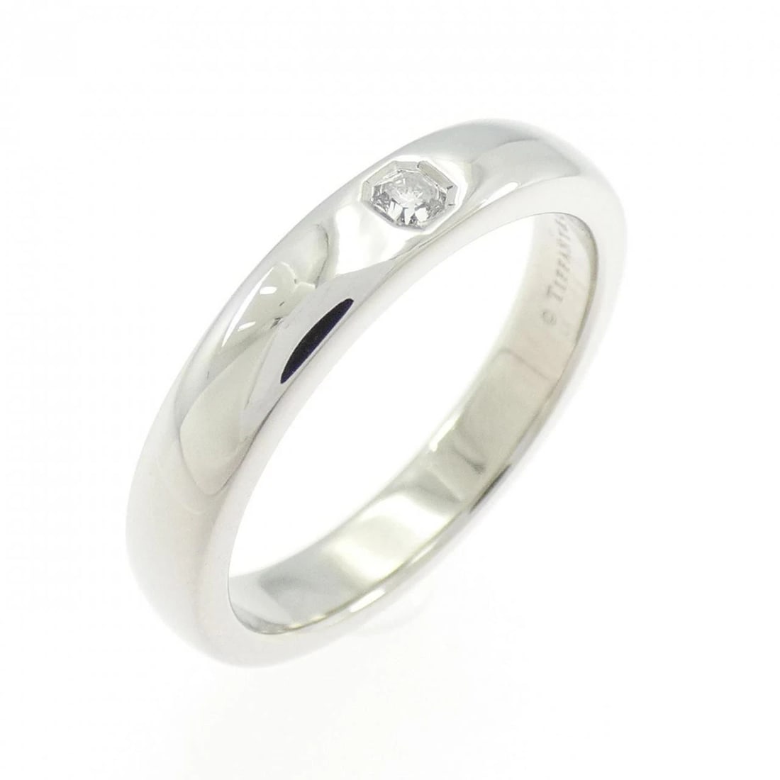 TIFFANY CLASSIC BAND RING: Tiffany Classic Band Ring Brand: Tiffany Type: Ring Material: Platinum 950, Main Stone/Creation Natural Color: White Size: 7-7.5 (US size) Accessories: None Accessories Notice: When