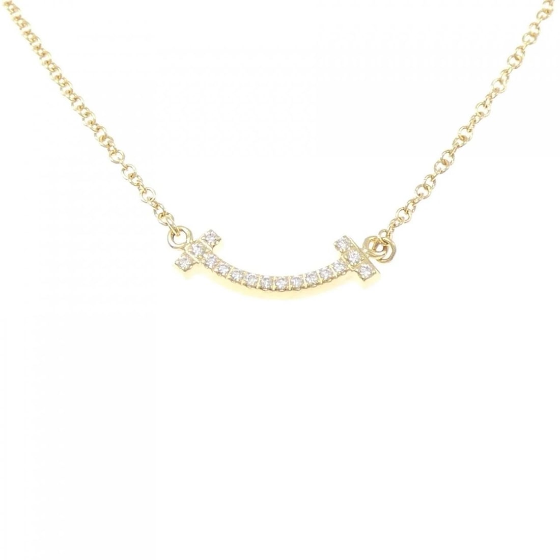 TIFFANY & CO. T SMILE MINI NECKLACE: TIFFANY & Co. T Smile Mini Necklace Brand: TIFFANY&Co. Type: Necklace Material: 18K, Main Stone/Creation Natural Color: Gold Size: Actual Size Pendant length approx. x width approx.: