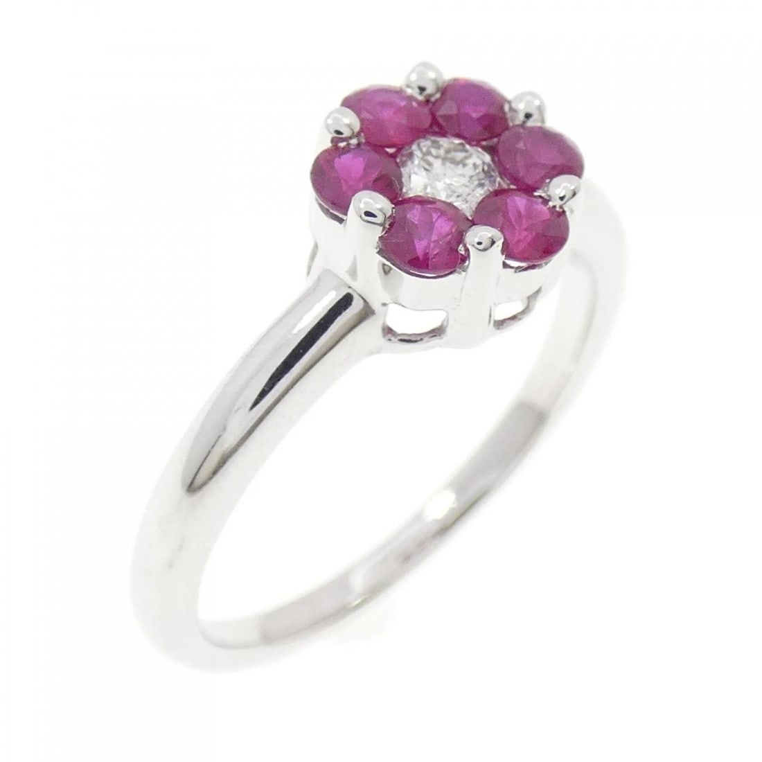 K18WG FLOWER RUBY RING: K18WG Flower Ruby Ring Brand: Unbranded Type: Ring Material: K18 White Gold, Main Stone/Creation Ruby Color: WG Size: 6.5 US Accessories: None Accessories Notice: When purchasing pre-owned