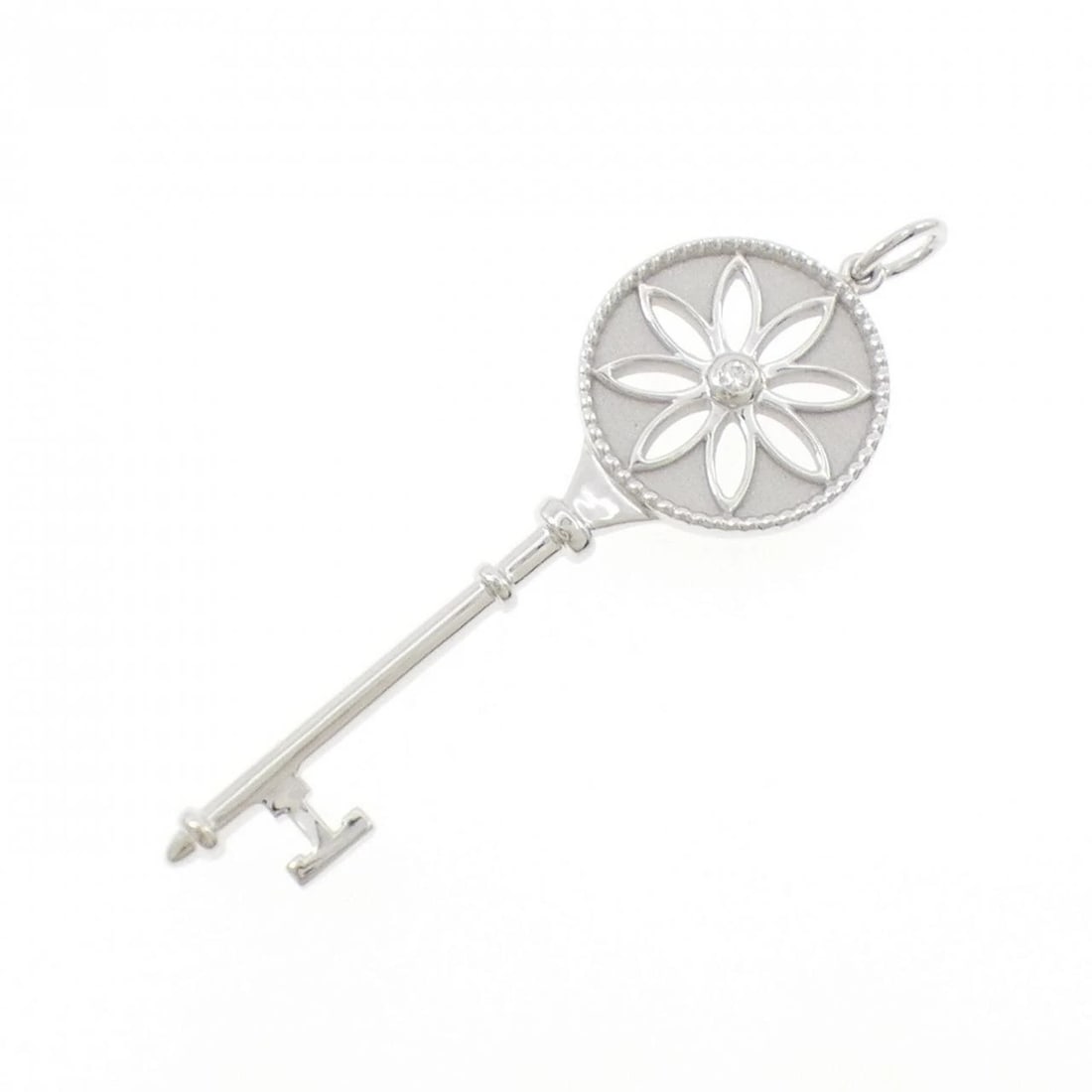 TIFFANY DAISY KEY PENDANT: Tiffany Daisy Key Pendant Brand: Tiffany Type: Pendant Brooch Material: 750 White Gold, Main Stone/Creation Natural Color: White Gold Size: ActualSize HxW: 67.2mmx20.9mm Accessories: None