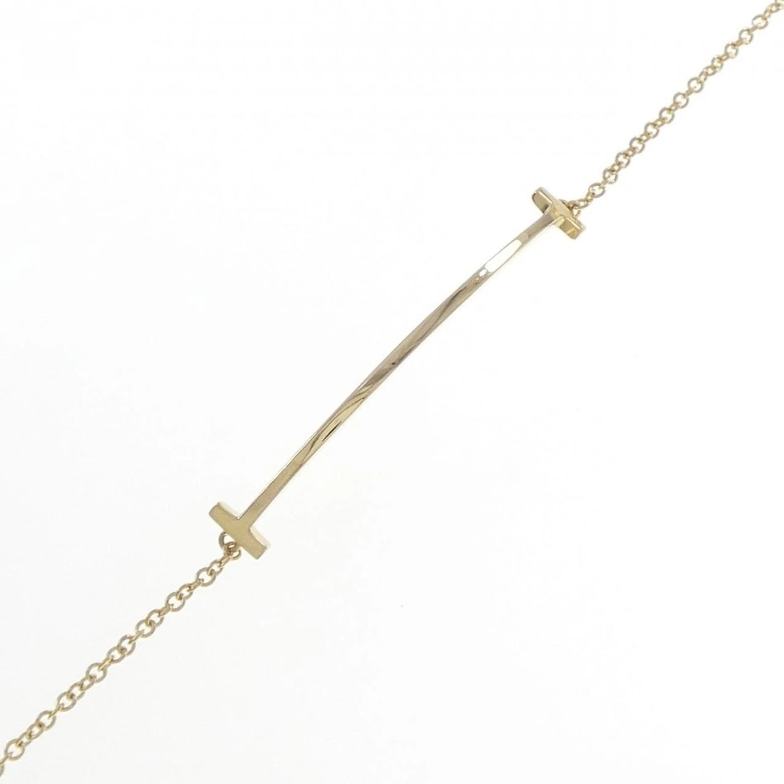 TIFFANY T SMILE BRACELET: Tiffany T Smile Bracelet Brand: Tiffany Type: Bracelet Material: 750 Yellow Gold, Color: Yellow Gold Size: ActualSize Max W: 5.6mm Size16.5cm Accessories: None Accessories Notice: When