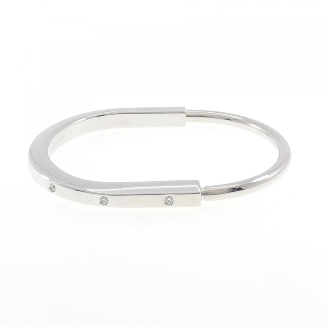 TIFFANY & CO. LOCK BANGLE: TIFFANY & Co. Lock Bangle Brand: TIFFANY&Co. Type: bracelet Material: 750 white gold, Main Stone/Creation Natural Color: white gold Size: 18cm, Actual Size Max width approx: 5.9mm Accessories: No