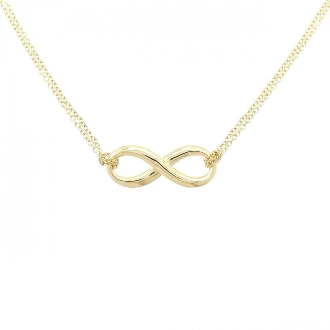 TIFFANY INFINITY NECKLACE: Tiffany Infinity Necklace Brand: Tiffany Type: Necklace Material: 750 Yellow Gold, Color: Yellow Gold Size: ActualSize Pendant top H x W: 8.0mmx20.3mm Chain Max. W: 1.1mm Accessories: None