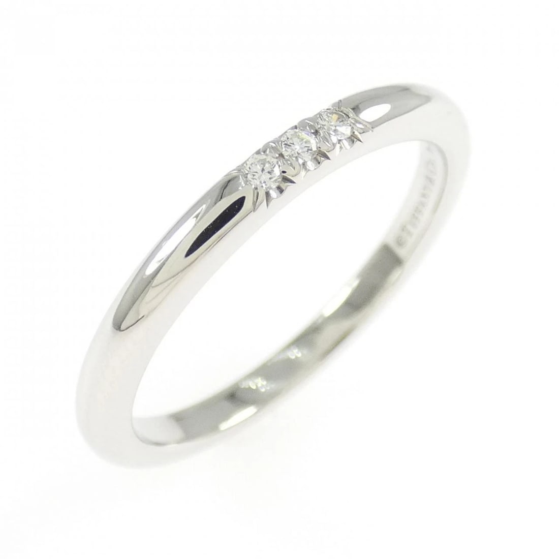 TIFFANY & CO. BAND RING: Tiffany & Co. band Ring Brand: Tiffany Type: Ring Material: Platinum 950, Main Stone/Creation Natural Color: White Gold Size: 5.5 (US size) Accessories: None Accessories Notice: When