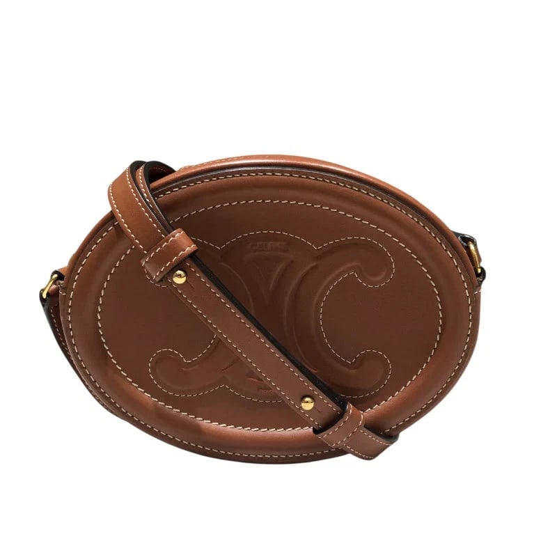 CELINE TRIOMPHE OVAL PURSE TAN CALF LEATHER HANDBAG: CELINE Triomphe Oval Purse Tan Calf Leather Handbag Brand: CELINE Type: Handbag Material: Calf Color: Tan Size: W: 16cm / H: 12cm / D: 4cm / Shoulder: 104-123cm Accessories: None Accessori