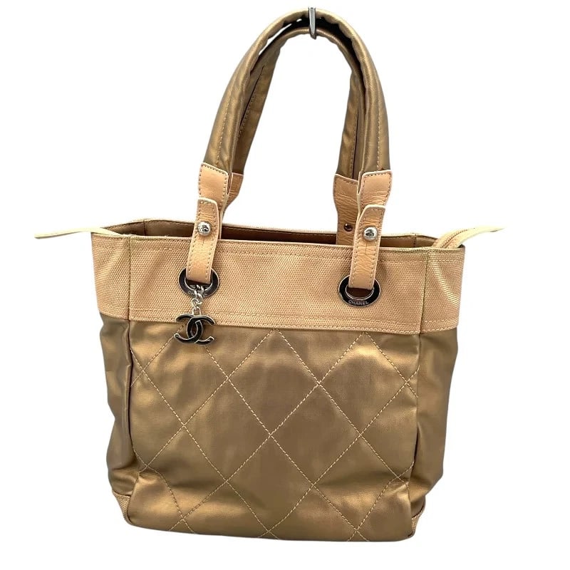 CHANEL PARIS BIARRITZ PM COATED CANVAS TOTE HANDBAG: CHANEL Paris Biarritz PM Coated Canvas Tote Handbag Brand: CHANEL Type: Handbag Material: Coated Canvas Color: Gold SV Hardware Size: W: 30cm / H: 24cm / D: 10cm Accessories: None Accessories