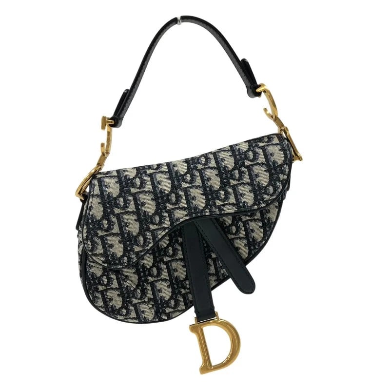 CHRISTIAN DIOR SADDLE BAG MINI OBLIQUE JACQUARD HANDBAG: Christian Dior Saddle Bag Mini Oblique Jacquard Handbag Brand: CHRISTIAN DIOR Type: Handbag Material: Oblique Jacquard Color: Navy/GD Hardware Size: W: 19cm / H: 13cm / D: 6cm Accessories: None