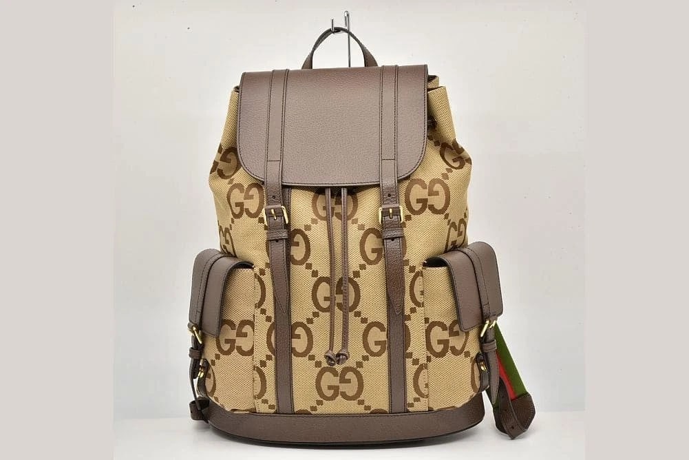 GUCCI JUMBO GG BACKPACK CAMEL EBONY HANDBAG: Gucci Jumbo GG Backpack Camel Ebony Handbag Brand: Gucci Type: Handbag Material: Canvas Leather Color: Camel Ebony Size: W34xH42xD16cm Accessories: None Accessories Notice: When purchasing