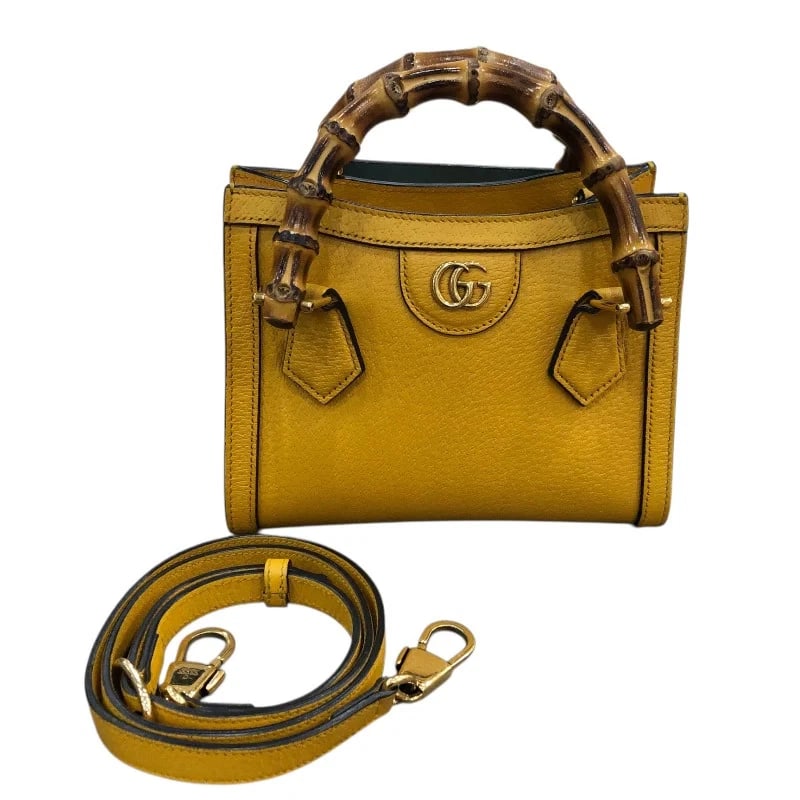 GUCCI DIANA SMALL YELLOW GHW CALF BAMBOO HANDBAG: GUCCI Diana Small Yellow GHW Calf Bamboo Handbag Brand: GUCCI Type: Handbag Material: Calf Leather, Bamboo Color: Yellow GD Hardware Size: W: 20cm / H: 16cm / D: 9cm Accessories: None Acce