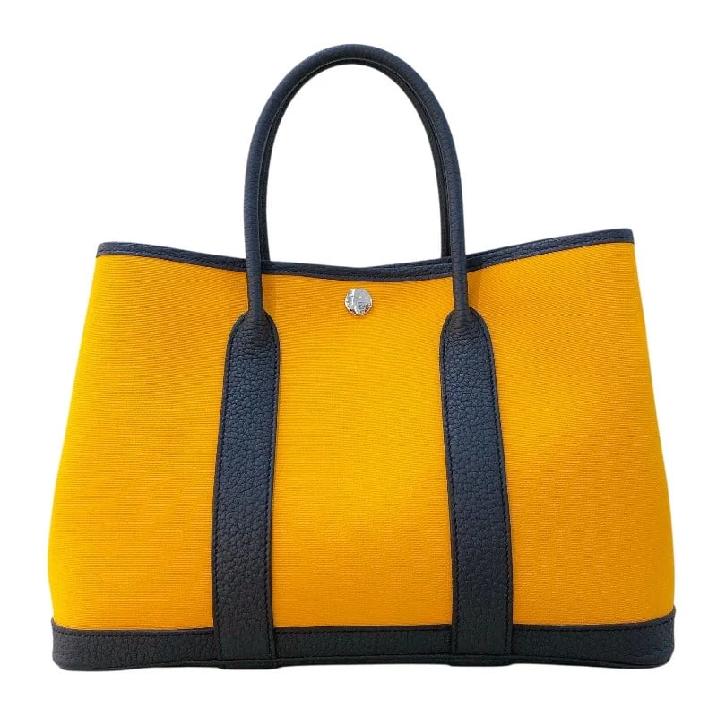 HERMES GARDEN PARTY STAMP MUSTARD BLUE INGO TOILE/NEGONDA HANDBAG: HERMES Garden Party Stamp Mustard Blue Ingo Toile/Negonda Handbag Brand: HERMES Type: Handbag Material: Toile/Negonda Color: Mutard Blueingo Size: W: 30cm / H: 21cm / D: 14cm Accessories: None