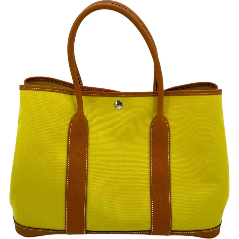 HERMES GARDEN PARTY STAMP LIME/TOFFEE SHW TOILE/NEGONDA HANDBAG: HERMES Garden Party Stamp Lime/Toffee SHW Toile/Negonda Handbag Brand: HERMES Type: Handbag Material: Toile/Negonda Color: Lime/Toffee SV Hardware Size: W: 36cm / H: 26cm / D: 18cm Accessories: N