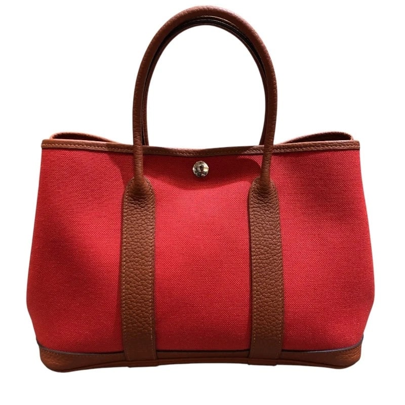 HERMES GARDEN PARTY TPM C STAMP RED - SHW TOILE HANDBAG: HERMES Garden Party TPM C Stamp Red - SHW Toile Handbag Brand: HERMES Type: Handbag Material: Toile Color: Red / SV Hardware Size: W: 30cm / H: 21cm / D: 14cm Accessories: None Accessories