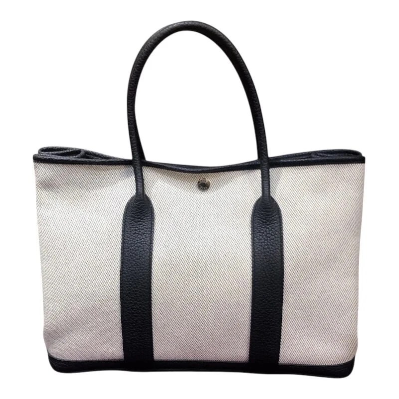 HERMES GARDEN PARTY PM C STAMP ECRU-BLACK TOILE/NEGONDA HANDBAG: HERMES Garden Party PM C Stamp Ecru-Black Toile/Negonda Handbag Brand: HERMES Type: Handbag Material: Toile/Negonda Color: Ecru Black Size: W: 36cm / H: 26cm / D: 17cm Accessories: None Ac