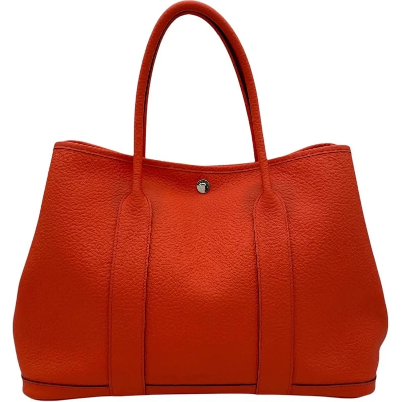 HERMES GARDEN PARTY PM X STAMP ORANGE POPPY HANDBAG: HERMES Garden Party PM X Stamp Orange Poppy Handbag Brand: HERMES Type: Handbag Material: Buckle Workshop/Country Color: Orange Poppy SV Hardware Size: W: 36cm / H: 27cm / D: 17cm Accessories: No