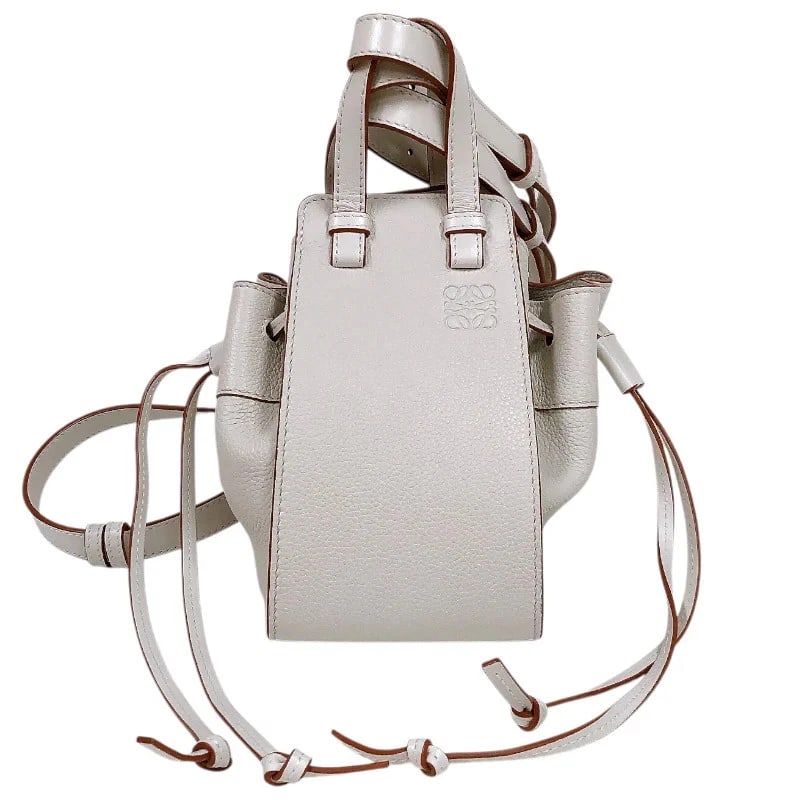 LOEWE HAMMOCK DRAWSTRING MINI BAG IVORY CALF HANDBAG: LOEWE Hammock Drawstring Mini Bag Ivory Calf Handbag Brand: LOEWE Type: Handbag Material: Calf Color: ivory Size: W: 20cm / H: 20cm / D: 15cm Accessories: None Accessories Notice: When pur