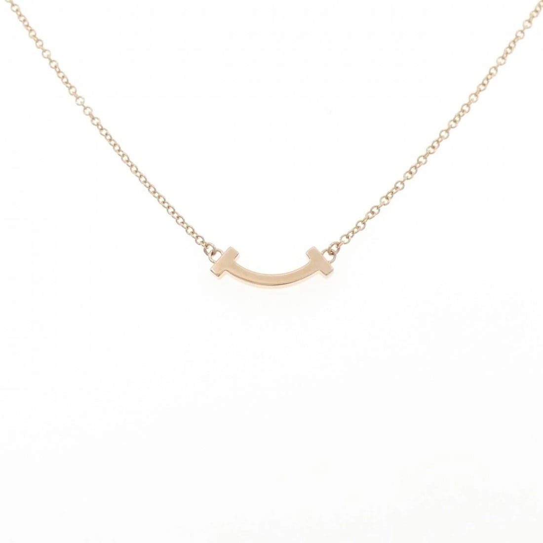 TIFFANY T SMILE MINI NECKLACE: Tiffany T Smile mini Necklace Brand: Tiffany Type: Necklace Material: 750 Pink Gold, Color: Pink Gold Size: 41/46cmActualSize Pendant top H x W: 3.7mmx12.9mm Chain Max. W: 1.1mm Accessories: