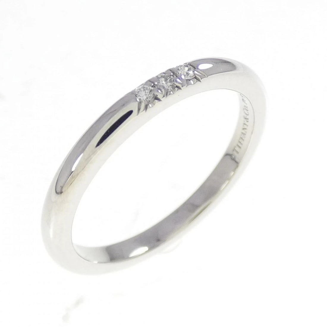 TIFFANY & CO. BAND RING: Tiffany & Co. band Ring Brand: Tiffany Type: Ring Material: Platinum 950, Main Stone/Creation Natural Color: White Size: 4.5-5 (US size) Accessories: None Accessories Notice: When purchasi