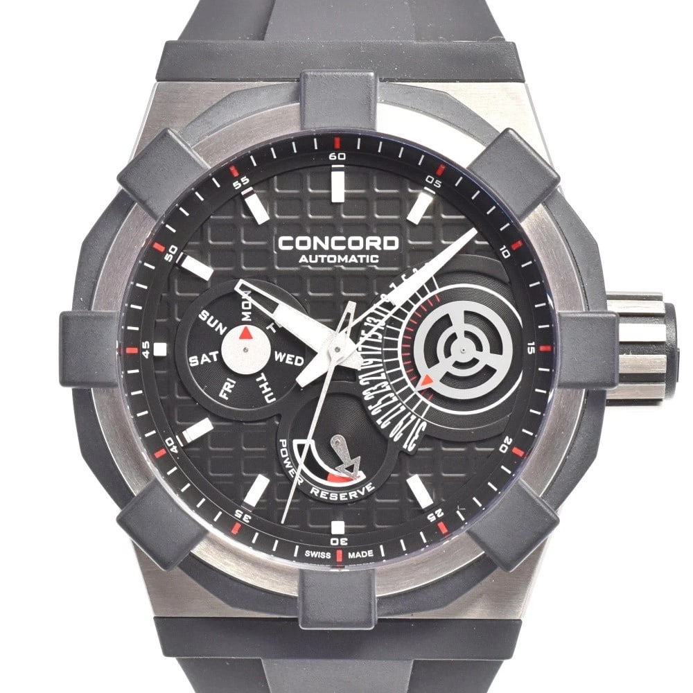 CONCORD RETROGRADE WATCH: Concord Retrograde Watch Brand: Concord Type: Wristwatch Material: Band Material rubber, Case Material titanium Color: Dial Color black, Case Color Silver Band Color black Size: Case size About 45