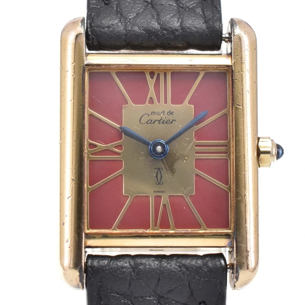 CARTIER MUST TANK LEATHER WATCH: CARTIER Must tank Leather Watch Brand: CARTIER Type: Wristwatch Material: Band Material leather, Case Material SV925?Gold Plated) Color: Dial Color wine-red, Case Color gold Band Color black 