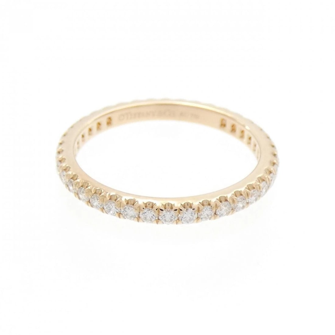 TIFFANY SOLESTE FULL CIRCLE RING: Tiffany Soleste Full Circle Ring Brand: Tiffany Type: Ring Material: 750 Pink Gold, Main Stone/Creation Natural Color: Pink Gold Size: 4.5-5 (US size) Accessories: None Accessories Notice: