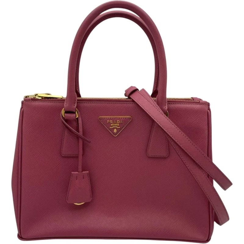 PRADA GALLERIA MEDIUM PINK SAFFIANO LEATHER HANDBAG: PRADA Galleria Medium Pink Saffiano Leather Handbag Brand: PRADA Type: Handbag Material: Saffiano Leather Color: pink Size: W: 27cm / H: 19.5cm / D: 12cm / Shoulder: 118-127.5cm Accessories: None