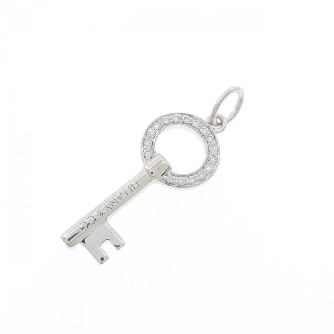 TIFFANY OPEN ROUND KEY PENDANT: Tiffany Open round Key Pendant Brand: Tiffany Type: Pendant Brooch Material: 750 White Gold, Main Stone/Creation Natural Color: White Gold Size: ActualSize HxW: 25.2mmx8.7mm Accessories: None