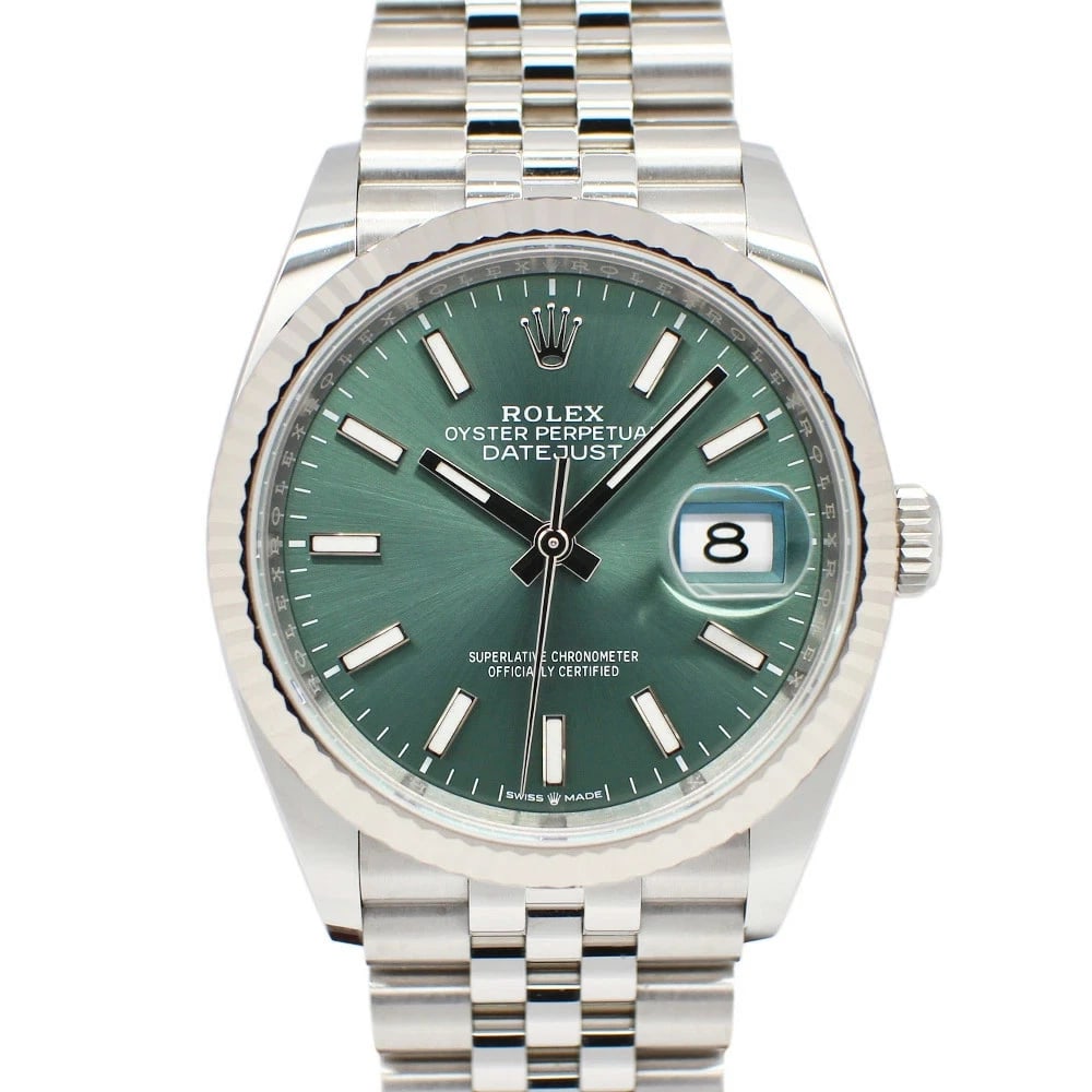 ROLEX DATEJUST GREEN WATCH: ROLEX Datejust Green Watch Brand: ROLEX Type: N/A Material: Band Material Ss/Wg, Case Material Sapphire Crystal Color: Band Color Green Size: Band Size 17cm, Case Size 36mm (excluding crown) 