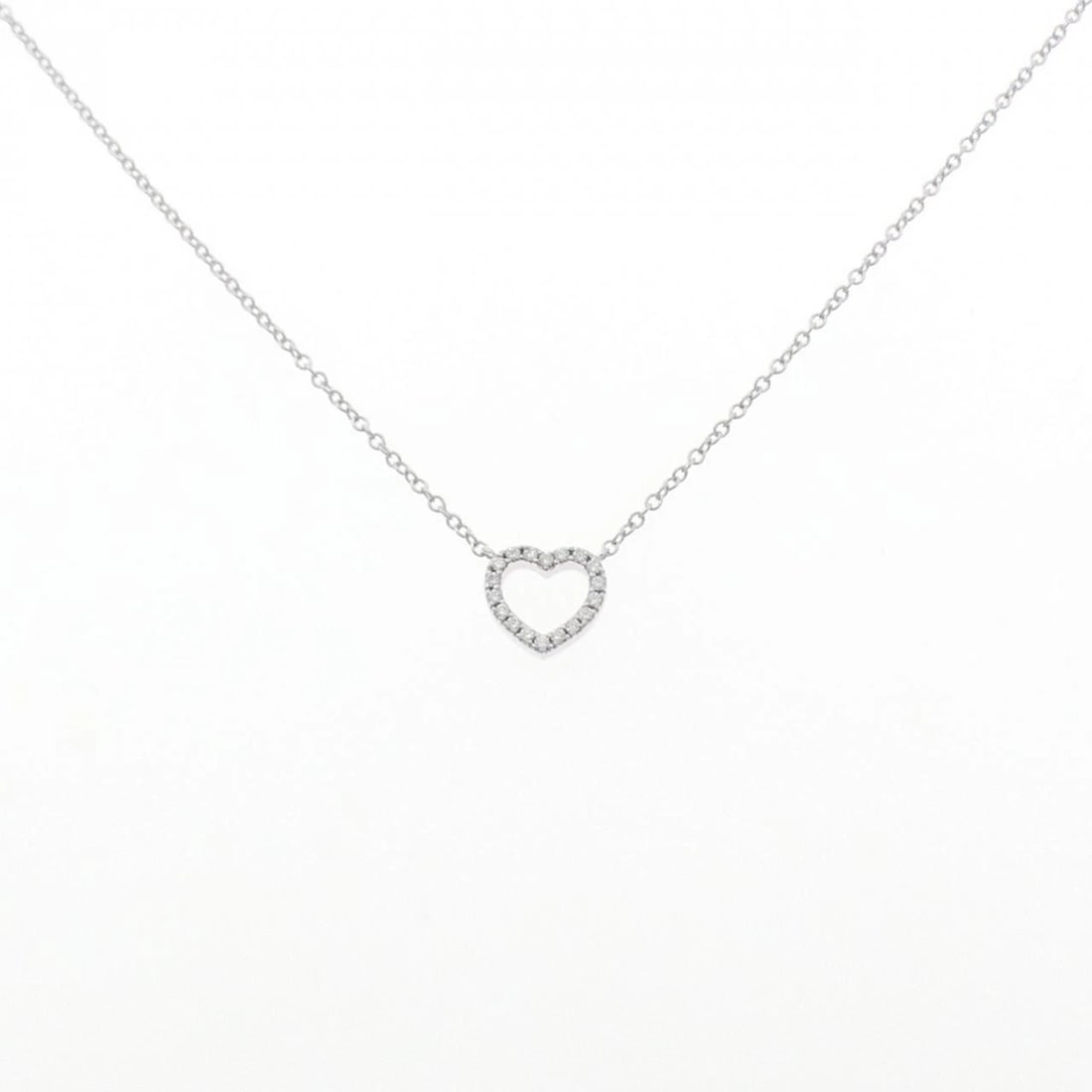 TIFFANY & CO. METRO HEART MINI NECKLACE: Tiffany & Co. Metro Heart mini Necklace Brand: Tiffany Type: Necklace Material: 750 White Gold, Main Stone/Creation Natural Color: White Gold Size: ActualSize Pendant top H x W: 7.5mmx7.9mm