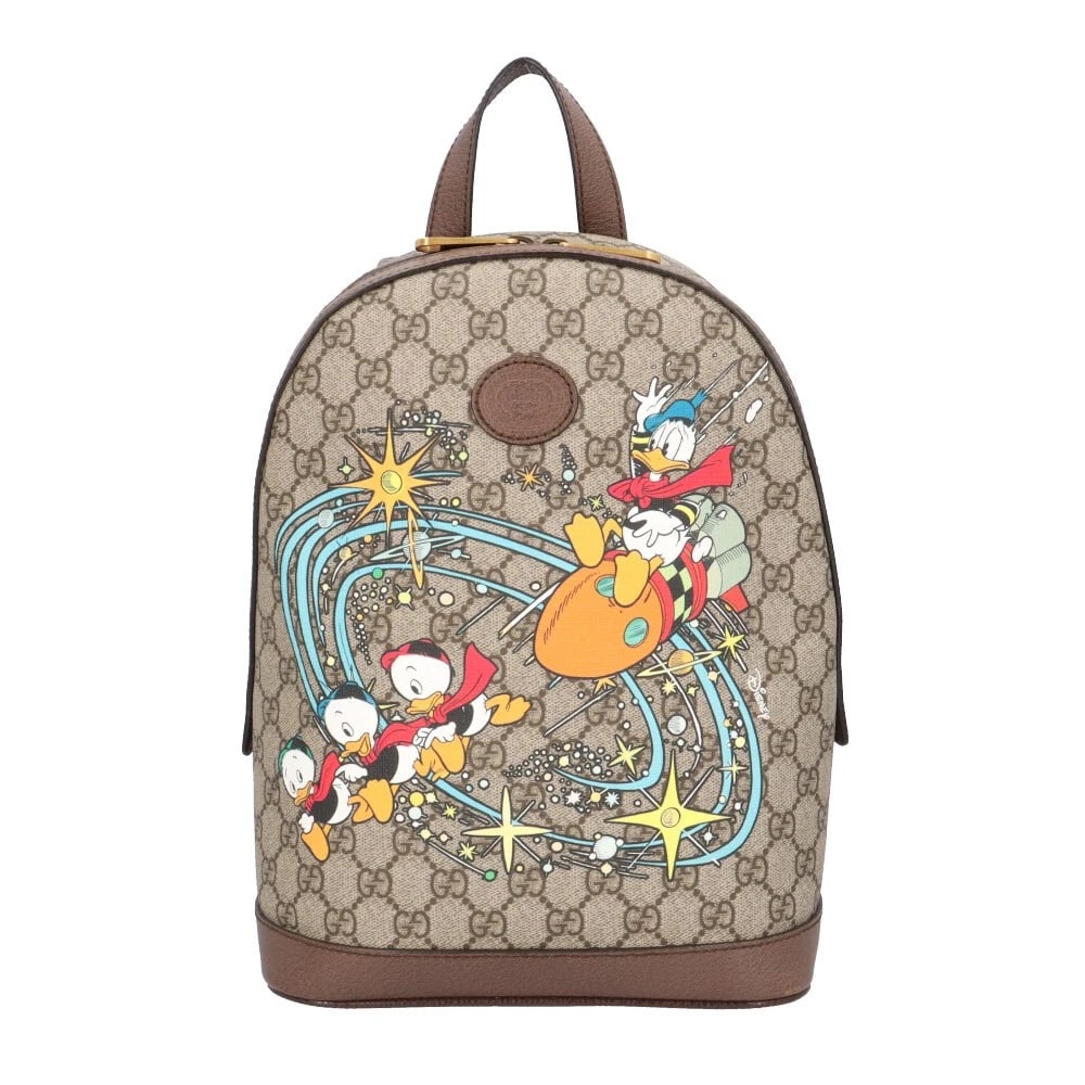 GUCCI DISNEY COLLABORATION BACKPACK Â· DAYPACK GG SUPREME CANVAS BACKPACK Â· DAYPACK: GUCCI Disney collaboration Backpack Â· Daypack GG Supreme Canvas Backpack Â· Daypack Brand: GUCCI Type: Backpack Â· Daypack Material: Exterior Material GG Supreme Canvas Color: beige / Brown