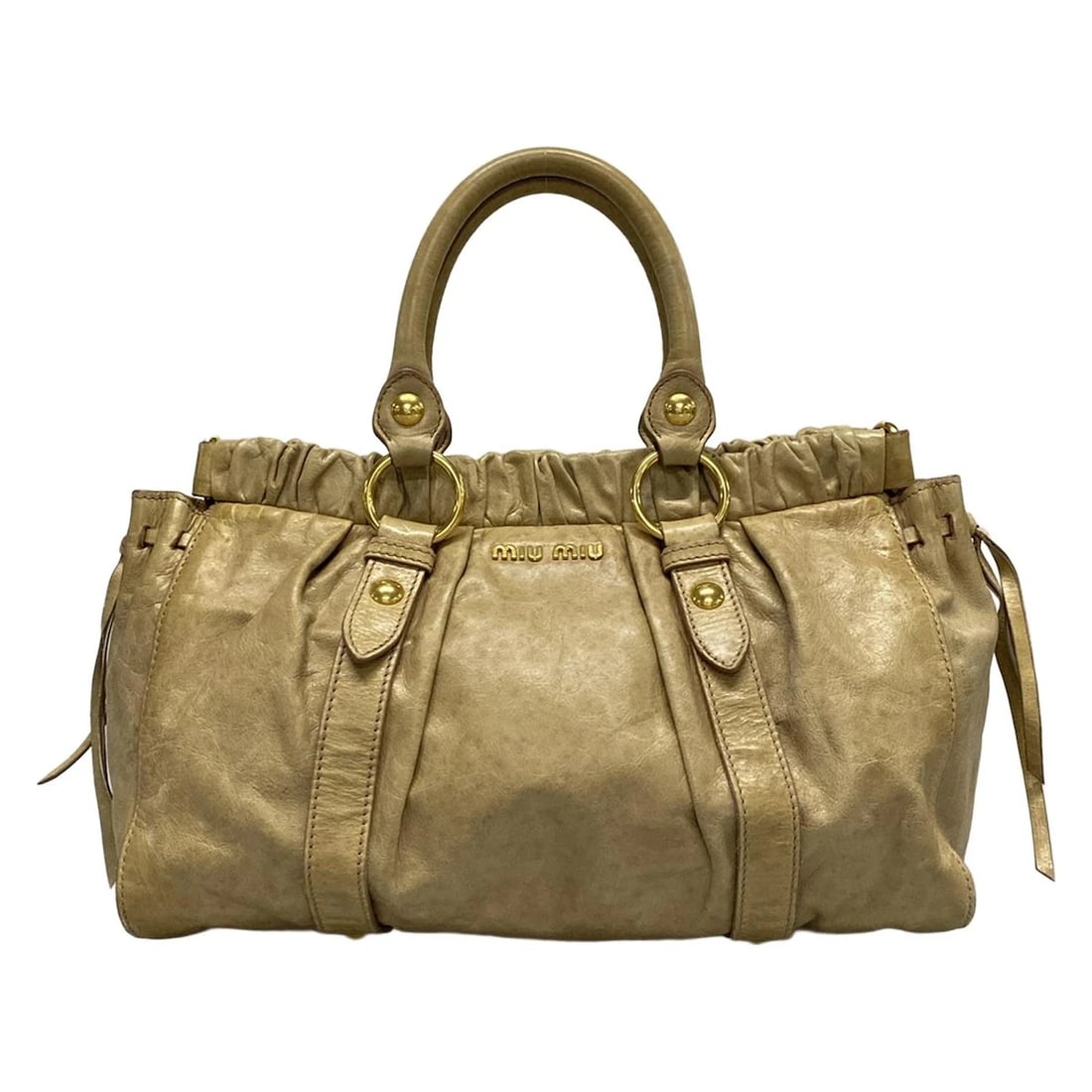 MIUMIU GATHERED BAG BEIGE LEATHER HANDBAG HANDBAG: miumiu Gathered Bag Beige Leather Handbag Handbag Brand: miumiu Type: Handbag Material: Leather Color: Beige Size: Height : 8.66 inch (22 cm) Width : 12.6 inch - 14.57 inch Depth : 4.33 inch"