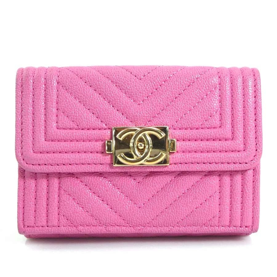 CHANEL BOY TRIFOLD WALLET PINK LEATHER/GOLDTONE TRI-FOLD WALLET: CHANEL Boy Trifold Wallet Pink Leather/Goldtone Tri-fold wallet Brand: CHANEL Type: Tri-fold wallet Material: Caviar skin leather Color: Pink Size: W:4.1inx H:3.0inx D:1.2in Accessories: None