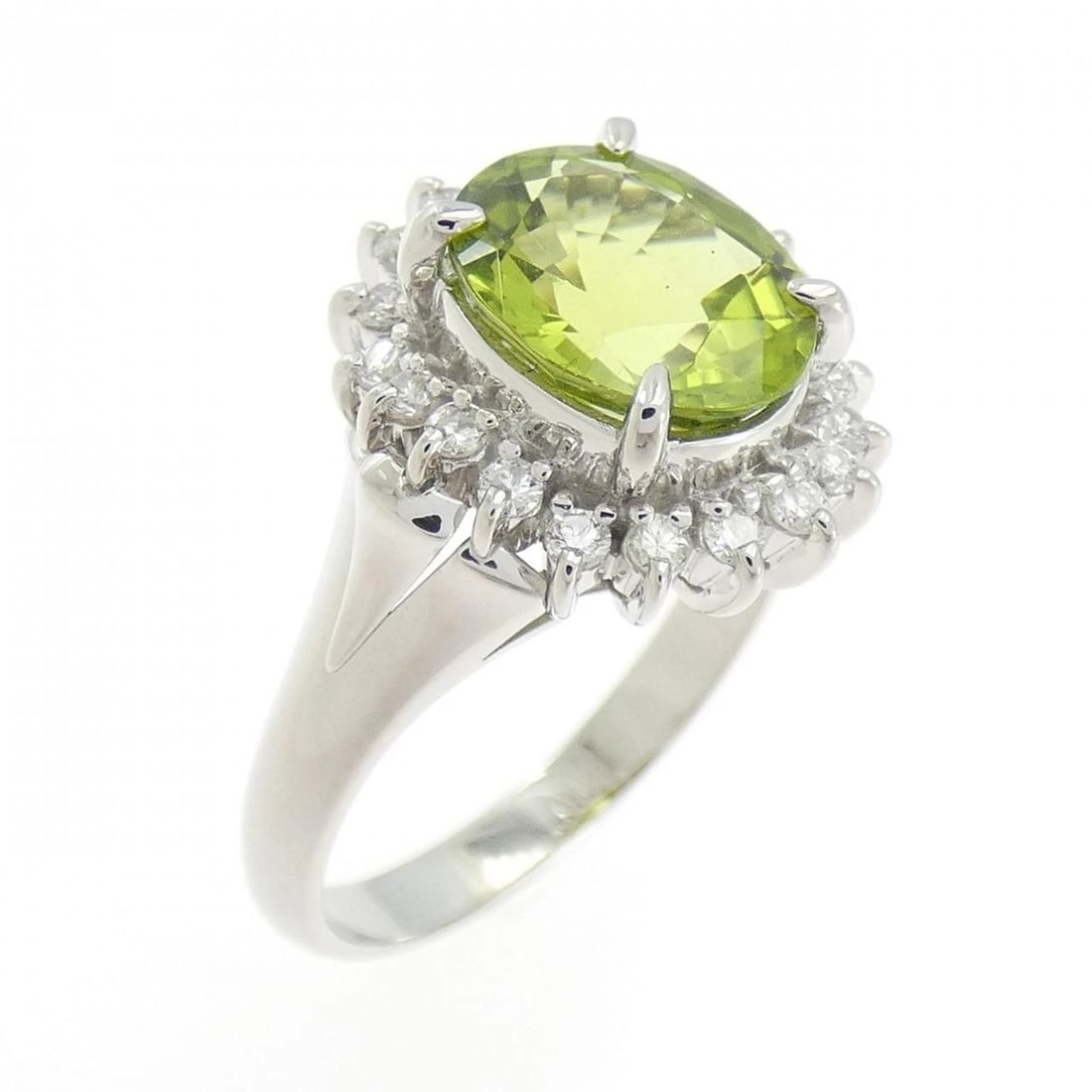 PT900 PERIDOT RING: PT900 Peridot Ring Brand: Unbranded Type: Ring Material: Platinum 900, Main Stone/Creation PeridotSide Stone Natural Color: Silver Size: 6.5 (US size) Accessories: None Accessories Notice: