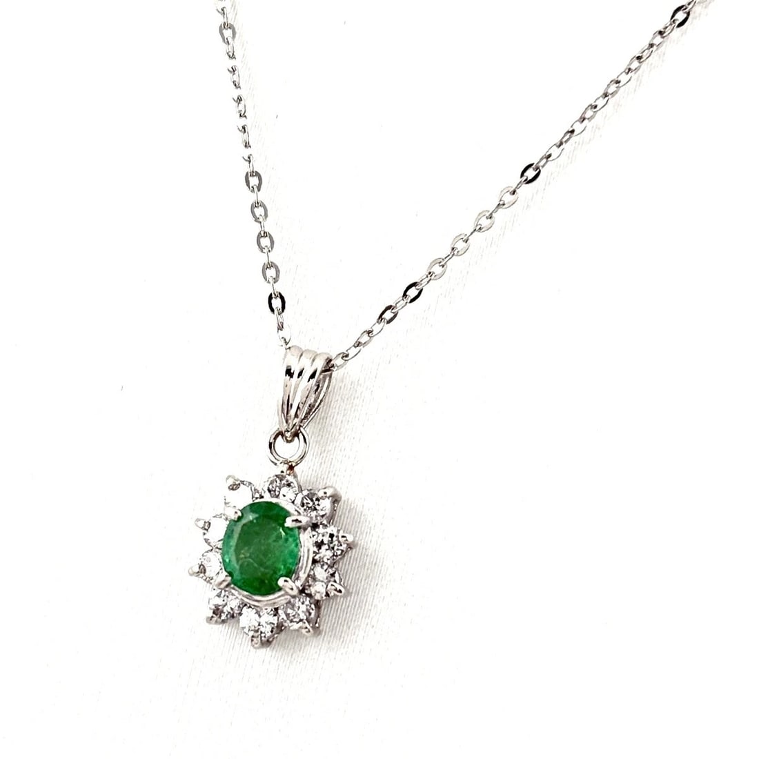 EMERALD DESIGN PLATINUM PENDANT MELEE DIAMOND NECKLACE: Emerald design Platinum Pendant Melee diamond Necklace Brand: Unbranded Type: Necklace Material: Pt900, Main Stone/Creation Emerald Color: Platinum Size: Chain 40.5cm(15.9") Total length of the pe