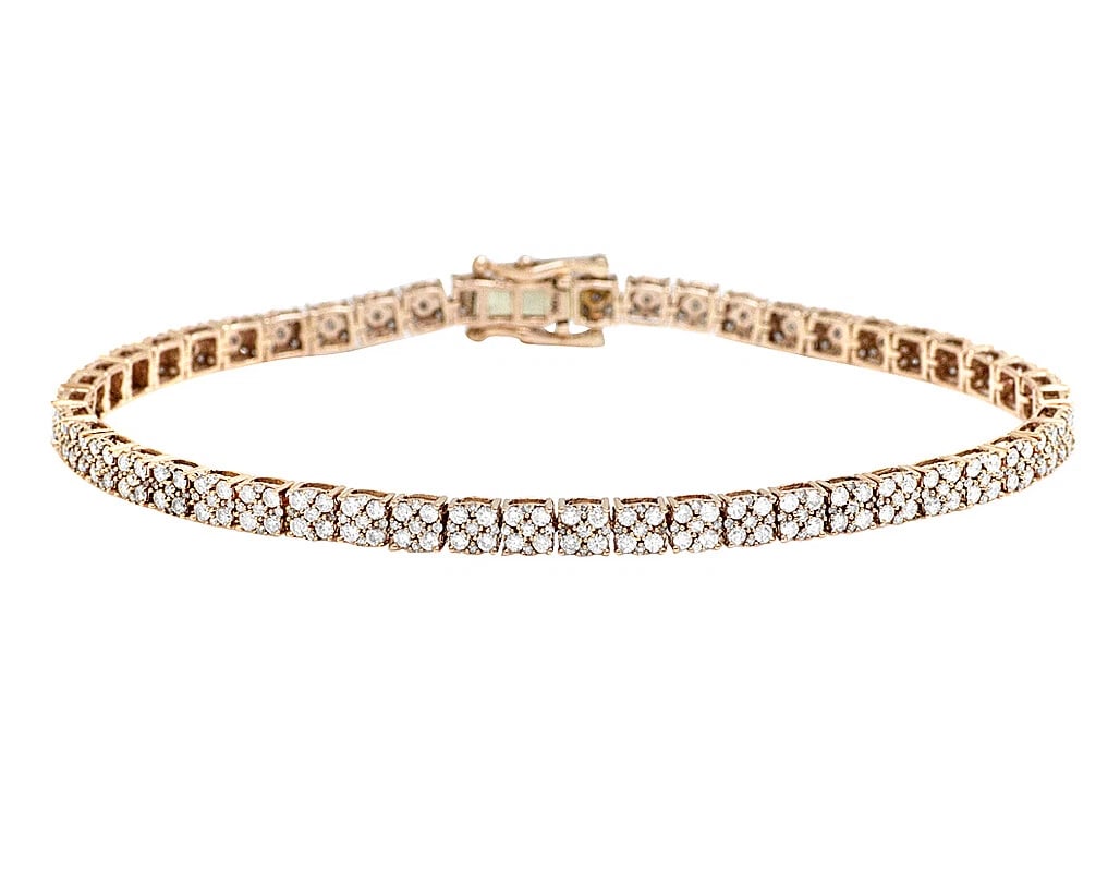 10K ROSE GOLD DIAMOND CLUSTER TENNIS BRACELET: 10K Rose Gold Diamond Cluster Tennis Bracelet Brand: None Type: Bracelet Material: 10k Rose Gold, Main Stone/Creation Natural Color: Rose Gold Size: Dimension 4.3MM Width 4.3MMmm Length 8 in. Acc