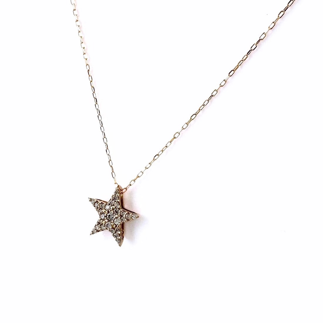 STAR MOTIF NECKLACE PG PINK GOLD PENDANT MELEE DIAMOND: Star motif Necklace PG Pink Gold Pendant Melee diamond Brand: Unbranded Type: Necklace Material: 18K, Color: Pink Gold Size: Chain 44.5cm(17.5") Pendant size 11.8×11.3mm(0.5") Accessories:
