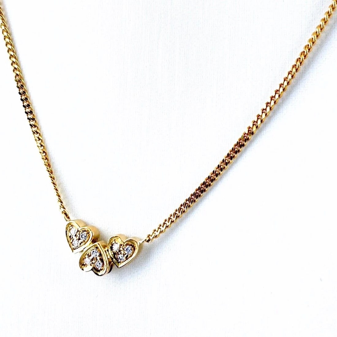 POLA MELEE DIAMOND DESIGN NECKLACE: POLA Melee diamond design necklace Brand: POLA Type: Necklace Material: 750, Color: Yellow Gold Size: Chain 43cm(16.9") Total length of the pendant head including a bail 15.7×7.9mm(0.6") 