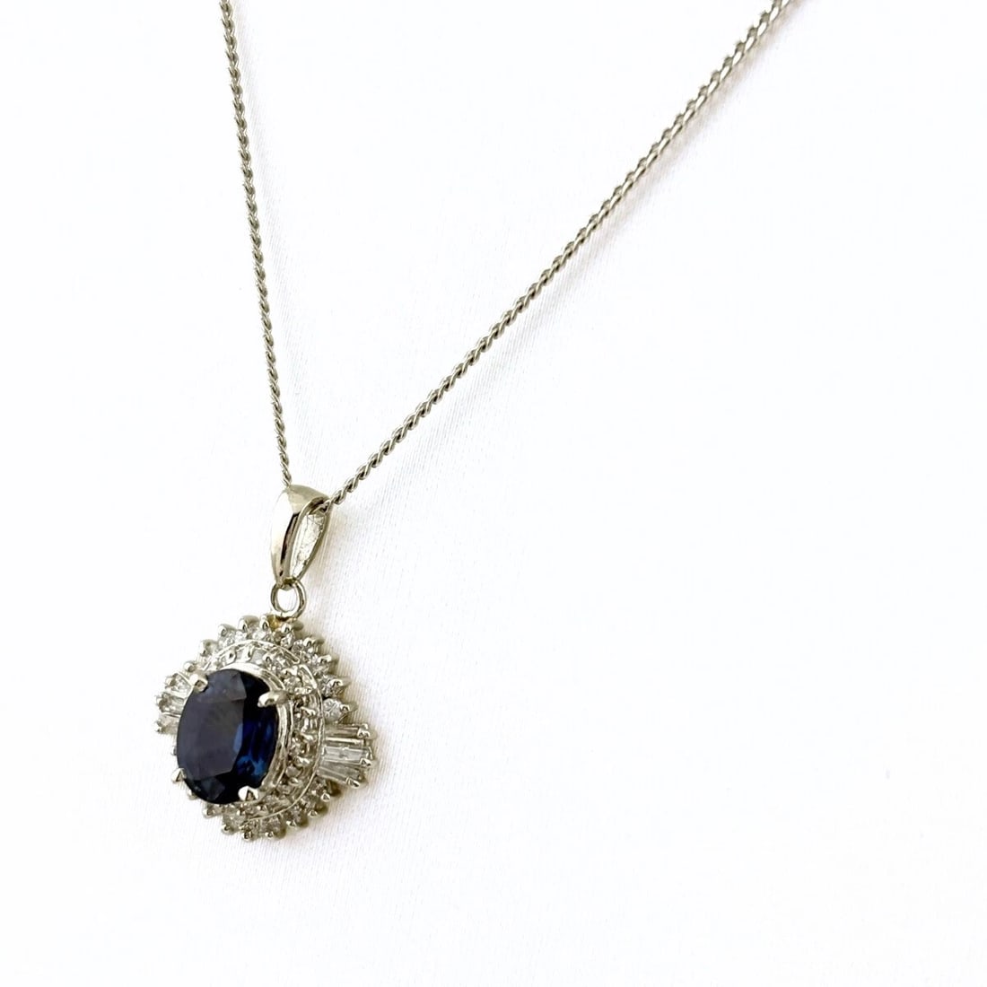 SAPPHIRE DESIGN NECKLACE PLATINUM PENDANT: Sapphire design necklace Platinum Pendant Brand: Unbranded Type: Necklace Material: Pt900, Main Stone/Creation Sapphire Color: Platinum Size: Chain 40cm(15.7") Pendant size 18.6×13.4mm(0.7") 