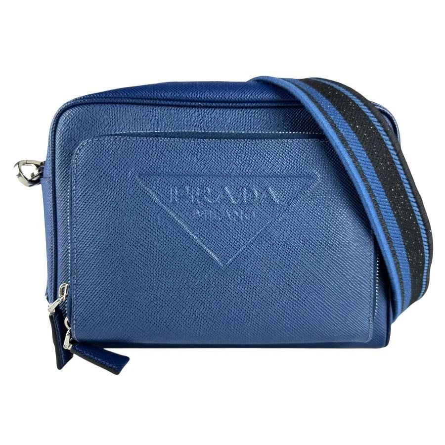 PRADA SHOULDER BAG BLUE/BLACK LEATHER/SILVERTONE SHOULDER BAG: PRADA Shoulder Bag Blue/Black Leather/Silvertone Shoulder Bag Brand: PRADA Type: Shoulder Bag Material: Leather Color: Blue Size: W:9.8inx H:7.9inx D:2.4in Shoulder Length: 44.1in Accessories: No
