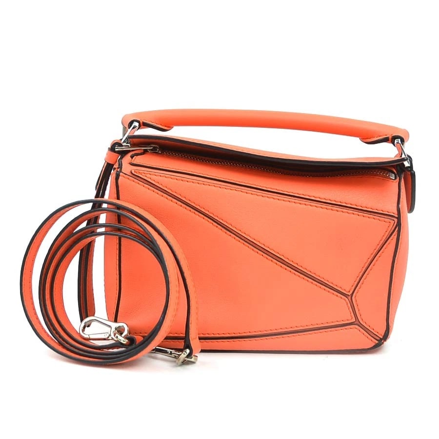 LOEWE PUZZLE BAG MINI CROSSBODY SHOULDER BAG HANDBAG CROSSBODY SHOULDER BAG: LOEWE Puzzle Bag Mini Crossbody Shoulder Bag Handbag Crossbody Shoulder Bag Brand: LOEWE Type: Crossbody Shoulder Bag Material: Leather Color: Orange Size: W:6.7inx H:4.7inx D:2.8in Handle drop:0.