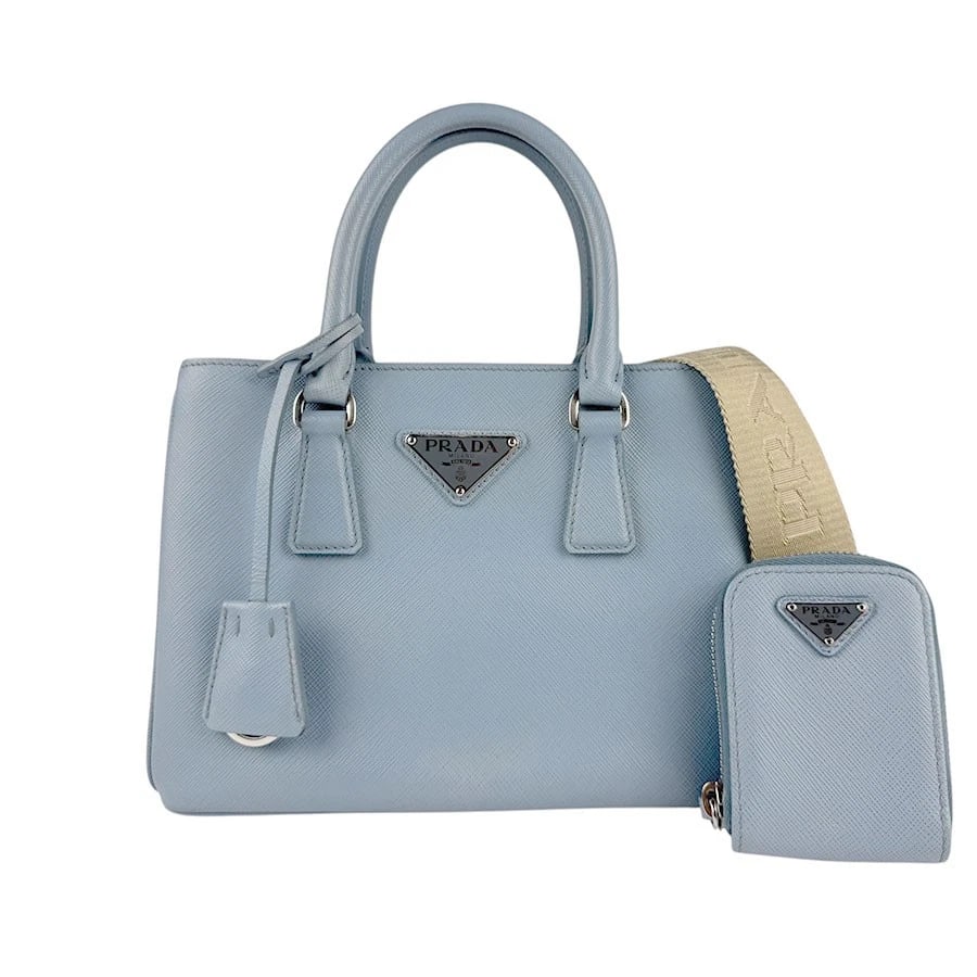 PRADA HANDBAG SHOULDER BAG LIGHT BLUE HANDBAG: PRADA Handbag Shoulder Bag Light Blue Handbag Brand: PRADA Type: Handbag Material: Leather Color: Light Blue Size: W:8.7inx H:6.3inx D:4.3in Handle Length:11.8in Accessories: None Accessories