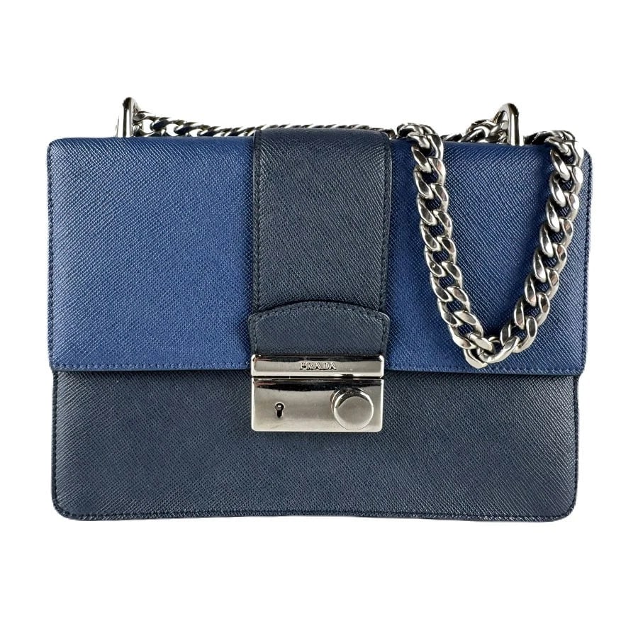 PRADA CHAIN SHOULDER BAG NAVY/SILVER SHOULDER BAG: PRADA Chain Shoulder Bag Navy/Silver Shoulder Bag Brand: PRADA Type: Shoulder Bag Material: Leather Color: Navy Size: W:8.3inx H:6.3inx D:2.0in Shoulder Length: 49.2in Accessories: None Ac