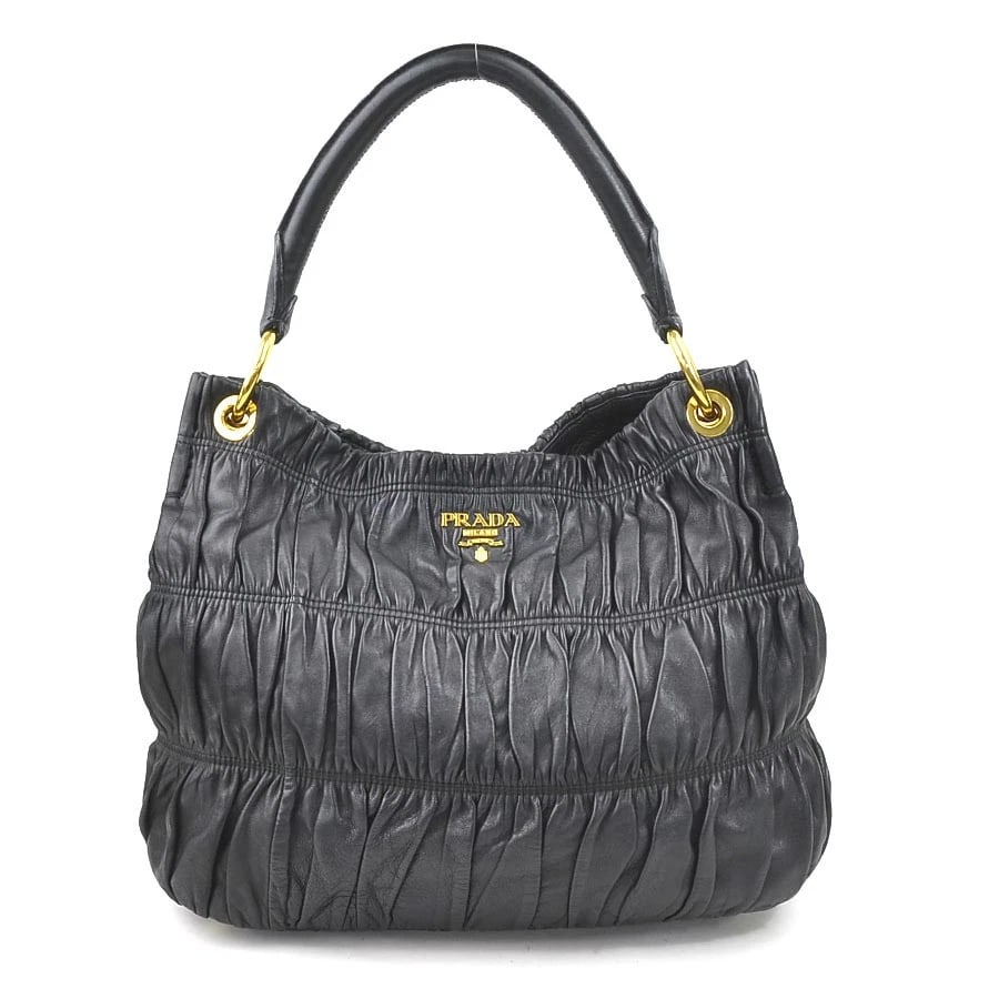 PRADA SHOULDER BAG BLACK LEATHER/GOLDTONE SHOULDER BAG: PRADA Shoulder Bag Black Leather/Goldtone Shoulder Bag Brand: PRADA Type: Shoulder Bag Material: leather Color: Black Size: W:13.4inx H:10.6inx D:6.3in Shoulder drop:7.1in Accessories: None