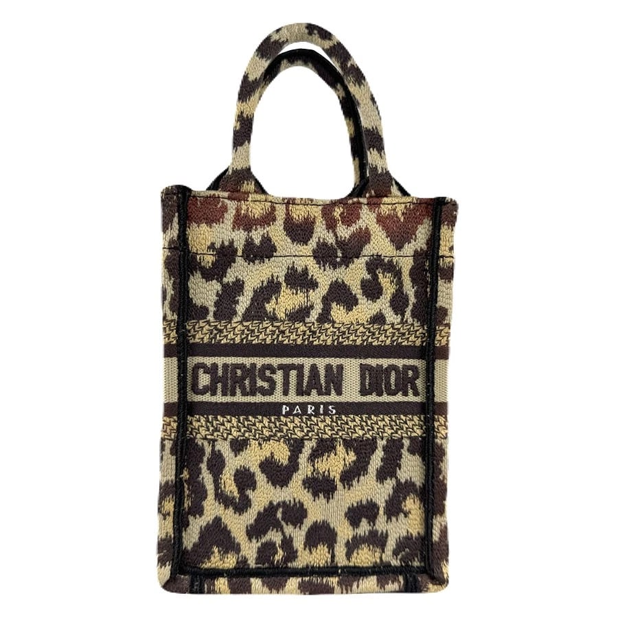 CHRISTIAN DIOR BOOK TOTE MINI PHONE BAG LEOPARD HANDBAG: Christian Dior Book Tote Mini Phone Bag Leopard Handbag Brand: Christian Dior Type: Handbag Material: Canvas Color: Brown Size: W:5.1inx H:7.1inx D:2.0in Handle Length:7.9in Accessories: None