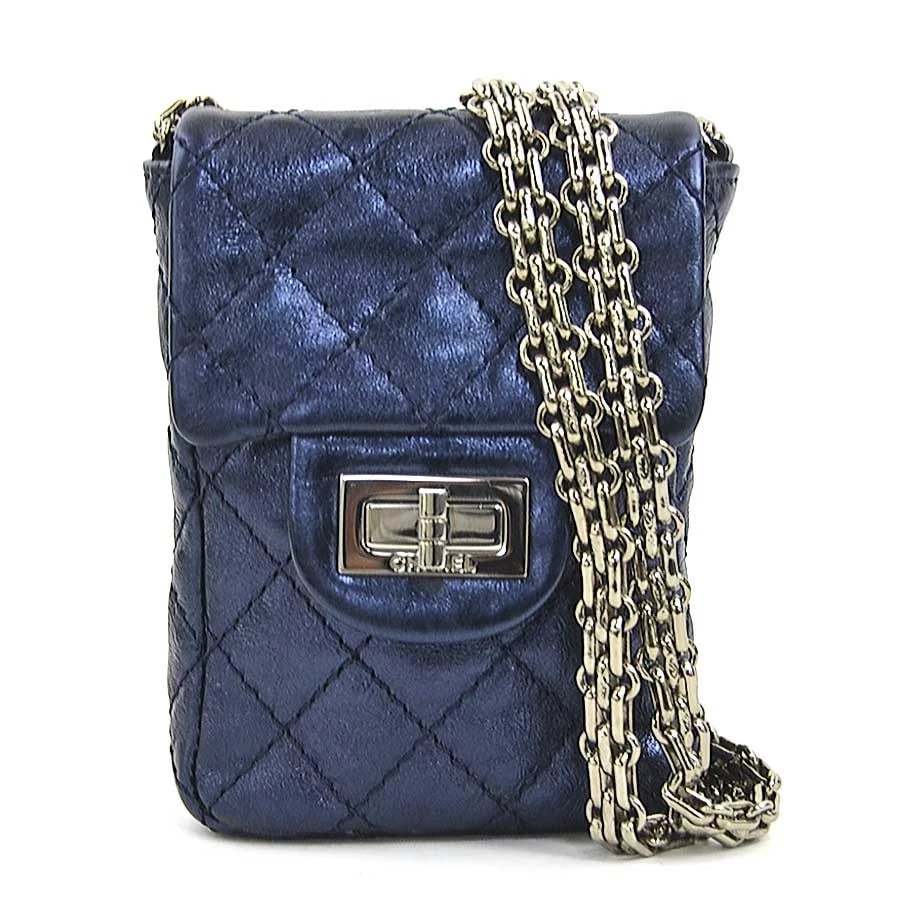 CHANEL CHAIN CROSSBODY SHOULDER BAG: CHANEL Chain Crossbody Shoulder Bag Brand: CHANEL Type: Shoulder Bag Material: Leather Color: Metallic Navy Size: W:3.5inx H:4.9inx D:1.0in Shoulder Length: 48.0in Accessories: None Access