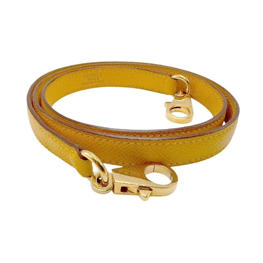 HERMES SHOULDER STRAP PRESUMED JAUNE LEATHER/GOLDTONE SHOULDER STRAP: HERMES Shoulder Strap Presumed Jaune Leather/Goldtone Shoulder strap Brand: HERMES Type: Shoulder strap Material: Estimated Couchevel leather Color: Presumed Jaune Size: Length:35.0in Maximum Widt