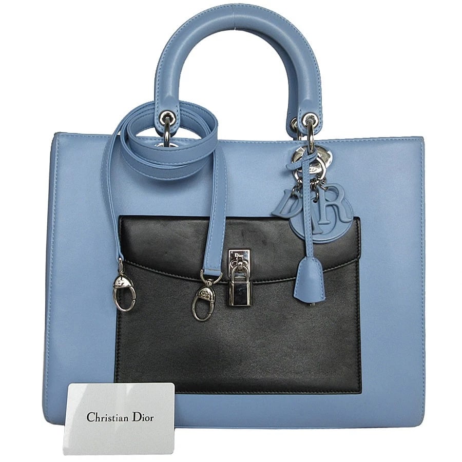 CHRISTIAN DIOR DIORISSIMO HANDBAG LIGHT BLUE X BLACK X WHITE LEATHER HANDBAG: Christian Dior Diorissimo Handbag Light blue x black x white leather Handbag Brand: Christian Dior Type: Handbag Material: leather Color: Light Blue X Black X White Size: W:12.6inx H:9.8inx D:4.7i