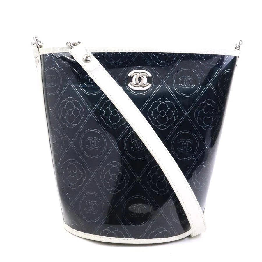CHANEL CAMELLIA SHOULDER BAG BLACK/WHITE PVC/LEATHER/SILVERTONE SHOULDER BAG: CHANEL Camellia Shoulder Bag Black/White PVC/Leather/Silvertone Shoulder Bag Brand: CHANEL Type: Shoulder Bag Material: PVC Color: Black X White Size: W:7.5inx H:9.8inx D:6.3in Shoulder Length: 34